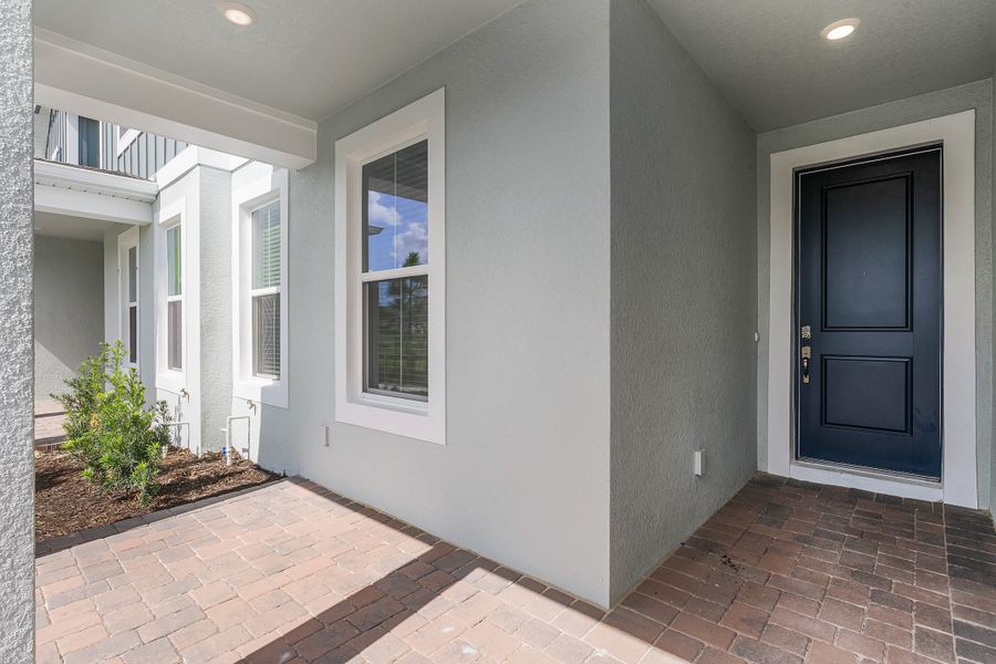 Representative exterior details of a home built from the Newton by Rockwell Homes in Harvest at Ovation - Townhomes, Winter Garden (Image 47). Representative exterior details of a home built from the Newton by Rockwell Homes in Harvest at Ovation - Townhomes, Winter Garden (Image 47).