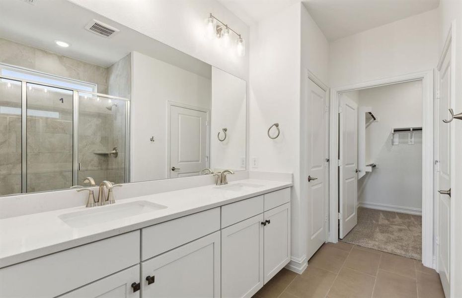 Elegant owner's bathroom with dual vanity *real home pictured Elegant owner's bathroom with dual vanity *real home pictured