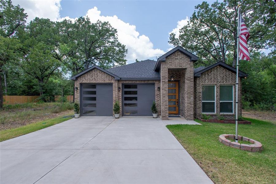 Front exterior of a new home in , Trinidad, TX, highlighting curb appeal (Image 21).