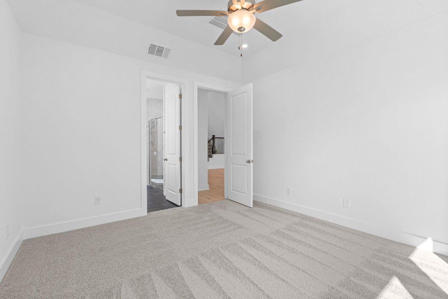 Primary Bedroom with elevated ceiling Primary Bedroom with elevated ceiling