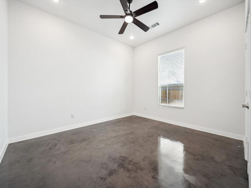 Empty room featuring ceiling fan