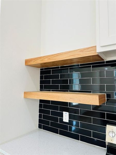 Floating shelves with classic black rich tile