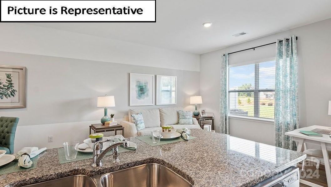 Kitchen looks into all main living spaces