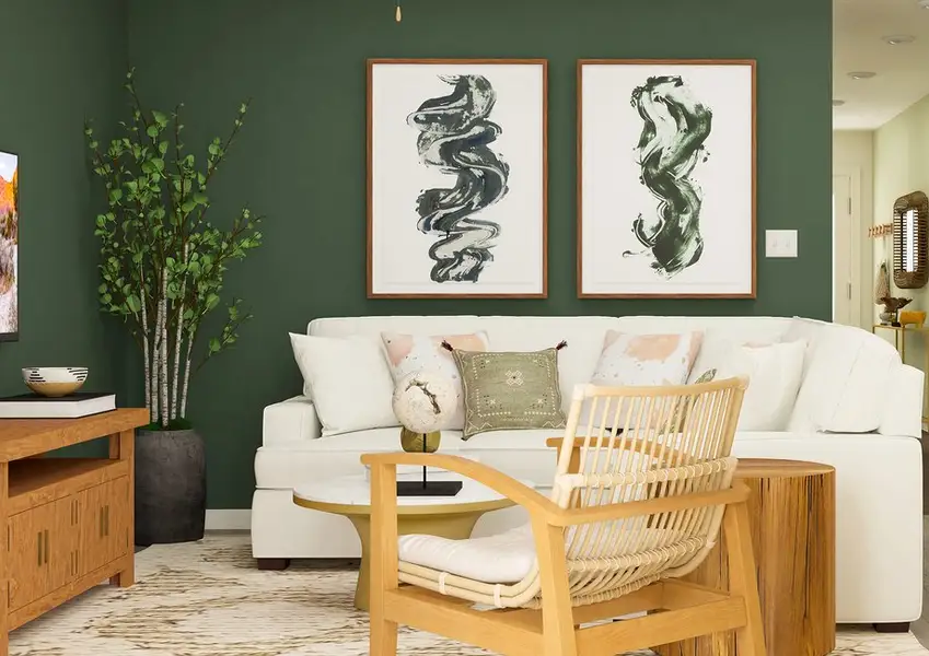 Rendering of a family room furnished with a large white sectional couch. The kitchen can be seen from behind the couch. Rendering of a family room furnished with a large white sectional couch. The kitchen can be seen from behind the couch.