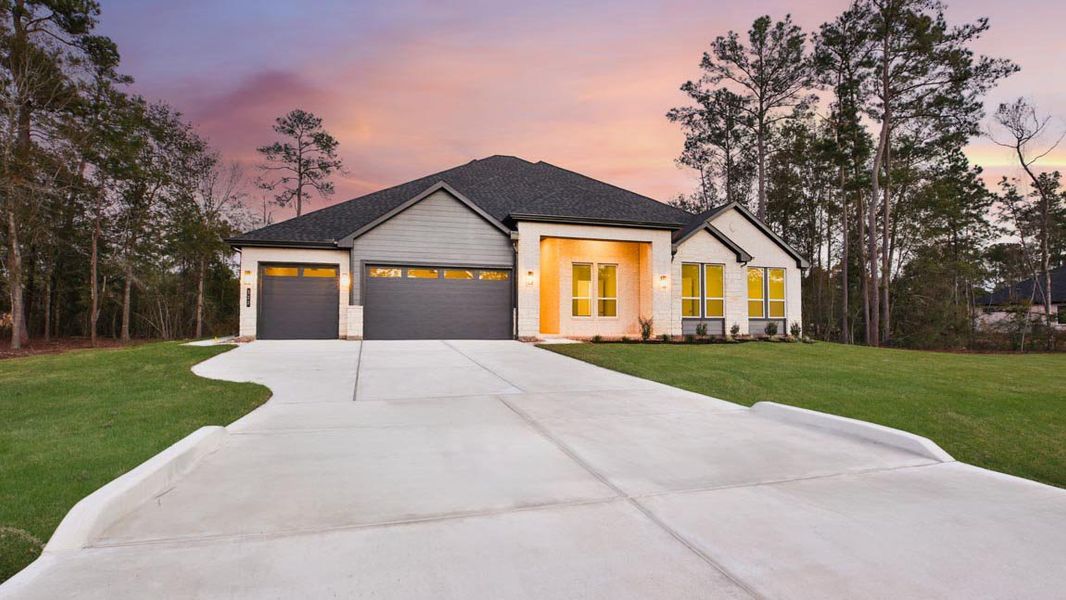 Front exterior of a new home in Butlers Bend Estates, Pinehurst, TX, highlighting curb appeal (Image 26).