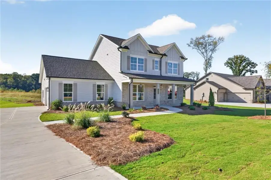 Front exterior of a new home in , Jefferson, GA, highlighting curb appeal (Image 24).