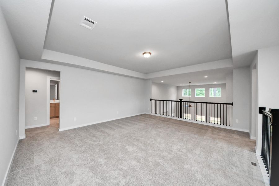 Ascend to relaxation in this fantastic game room! Ideal for both casual gatherings and adult gaming, it boasts plush carpet, lofty ceilings, custom paint, and ample windows for abundant natural light. Ascend to relaxation in this fantastic game room! Ideal for both casual gatherings and adult gaming, it boasts plush carpet, lofty ceilings, custom paint, and ample windows for abundant natural light.