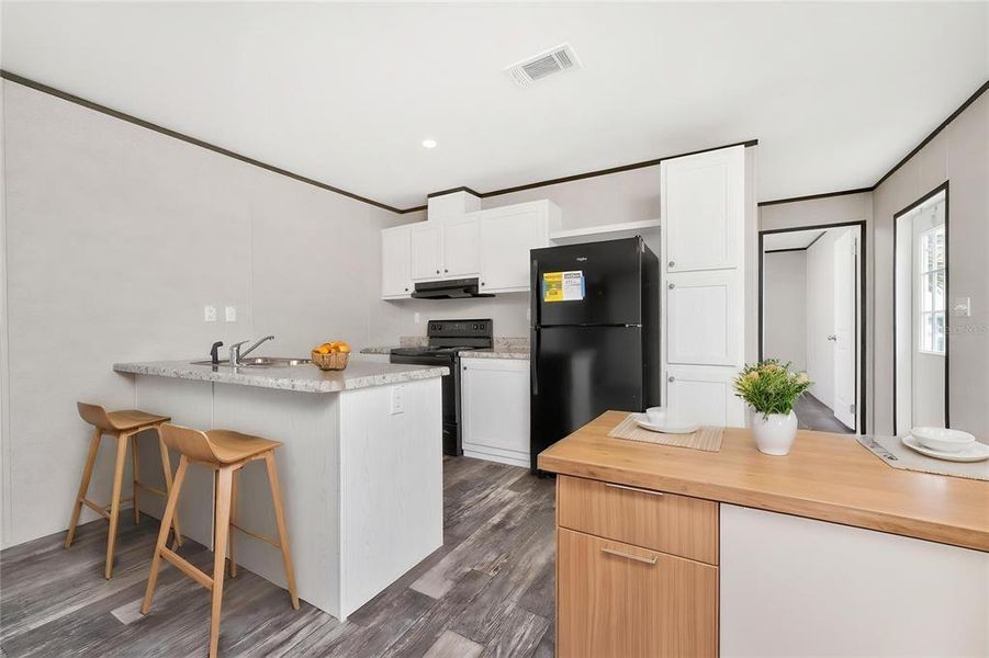 Furnished interior view inside a new home in , Port Charlotte (Image 11).