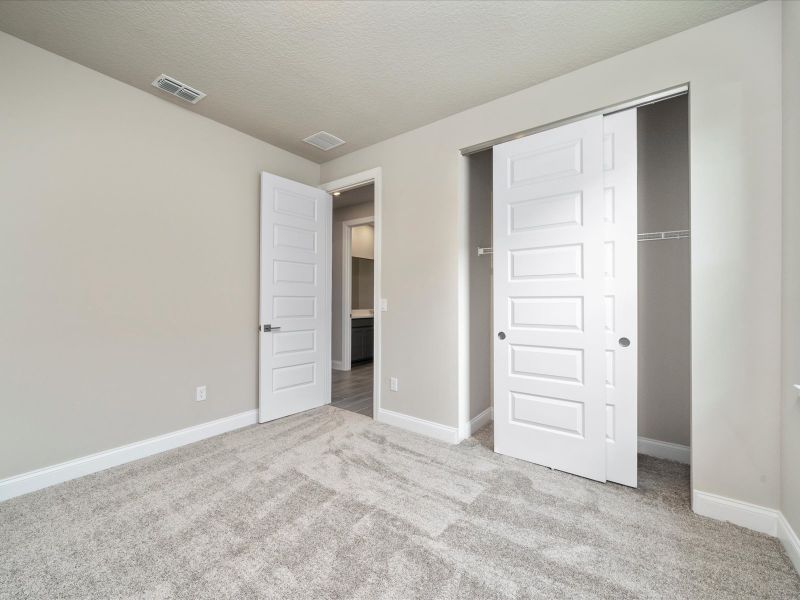 Bedroom in the Onyx floorplan at 6383 NW Sweetwood Drive in Brystol at Wylder