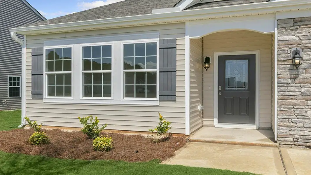 Exterior details and patio area of a home in Villa Grande, Winterville (Image 3).