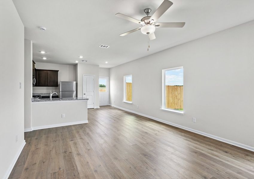 The open living spaces have large windows that let in great, natural light.