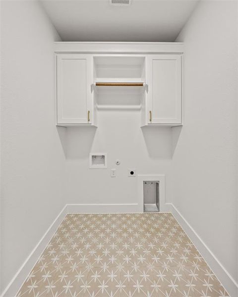 Laundry room featuring gas dryer hookup, electric dryer hookup, and washer hookup Laundry room featuring gas dryer hookup, electric dryer hookup, and washer hookup