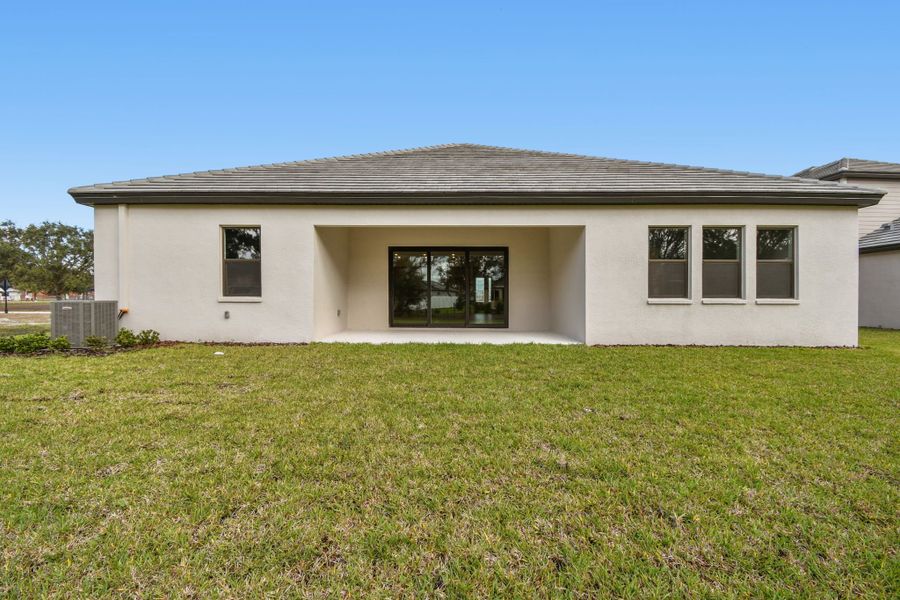 Exterior details and patio area of a home in River Preserve Estates, Parrish (Image 35).
