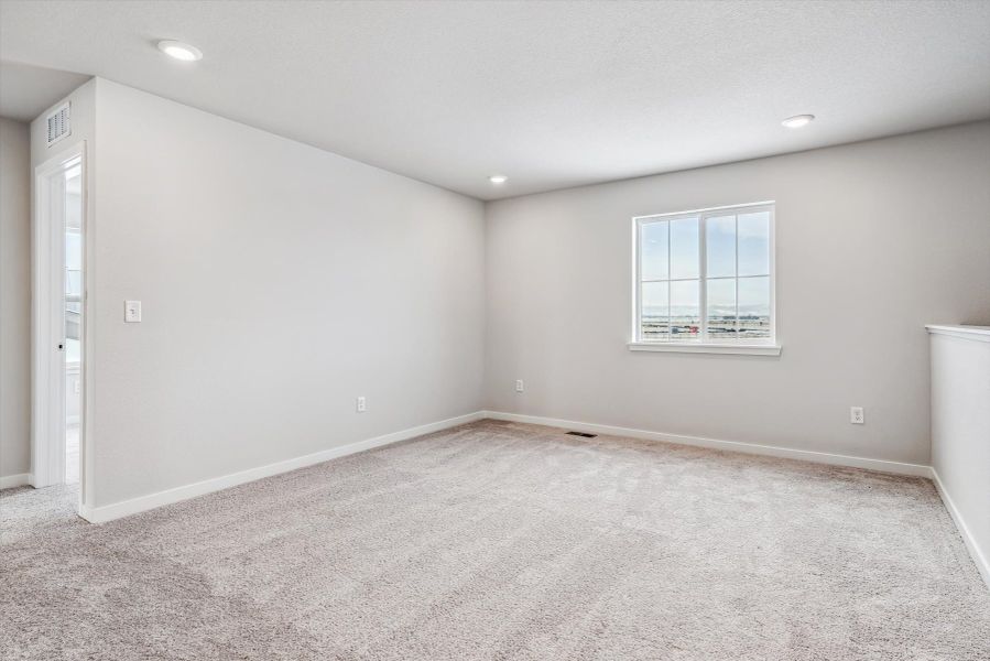 A room with a window and a door.