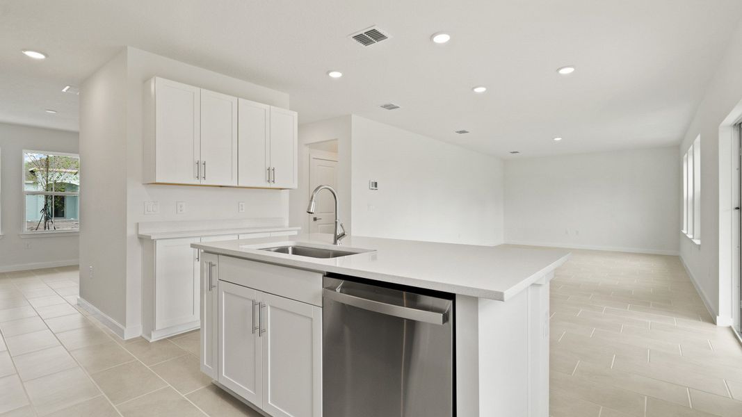 Highbourne Kitchen and Living Area by DRB Homes in Willowbrook North located in Winter Haven, FL. Highbourne Kitchen and Living Area by DRB Homes in Willowbrook North located in Winter Haven, FL.