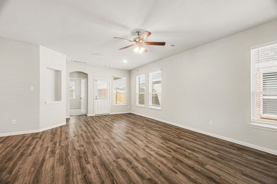 Bright and open living area with wood floors. Bright and open living area with wood floors.