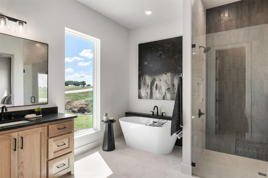 Full bathroom with a tile shower, a freestanding tub Full bathroom with a tile shower, a freestanding tub