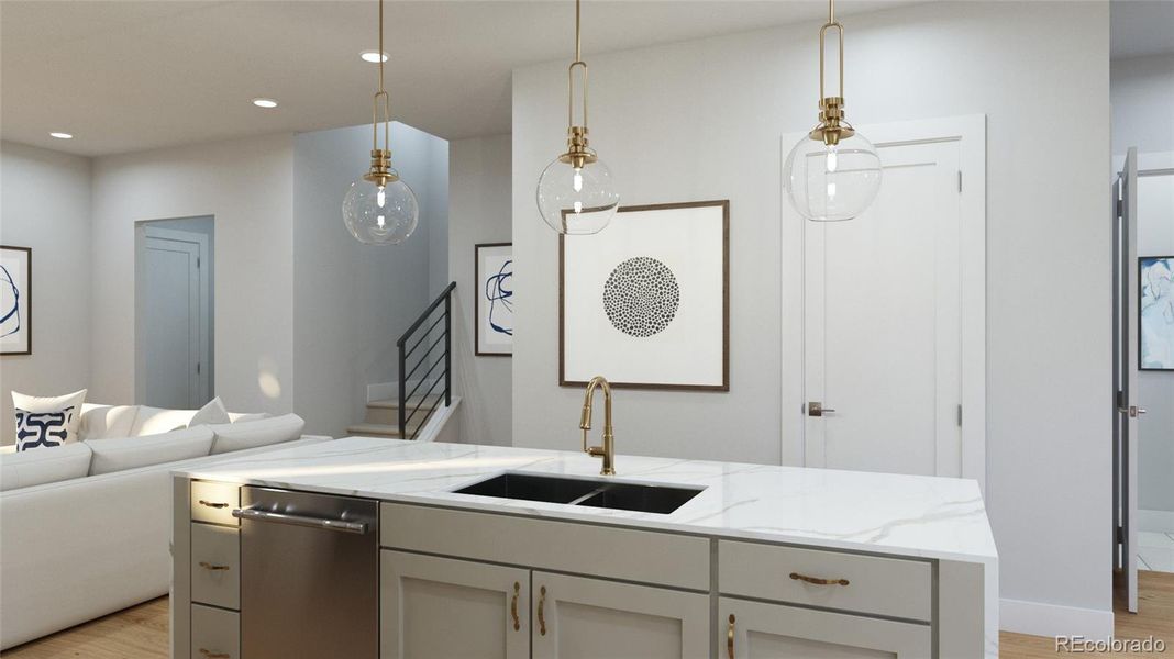 Kitchen option features custom designer lighting. Disclaimer: Images are representative of available finishes. Finishes in homes under construction may vary.