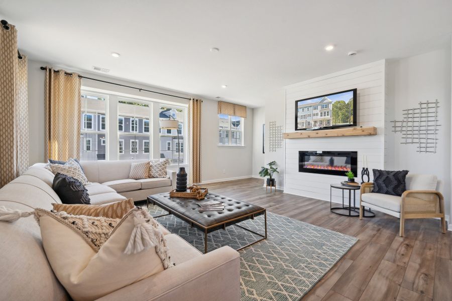 A living room with a fireplace.