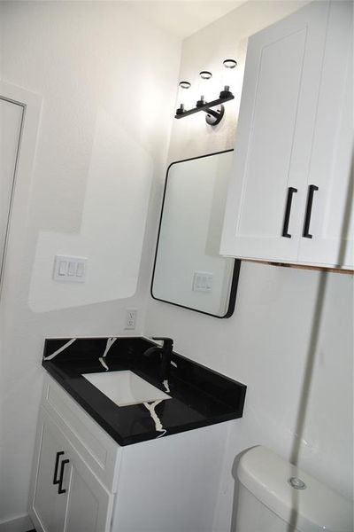 Bathroom with vanity and toilet