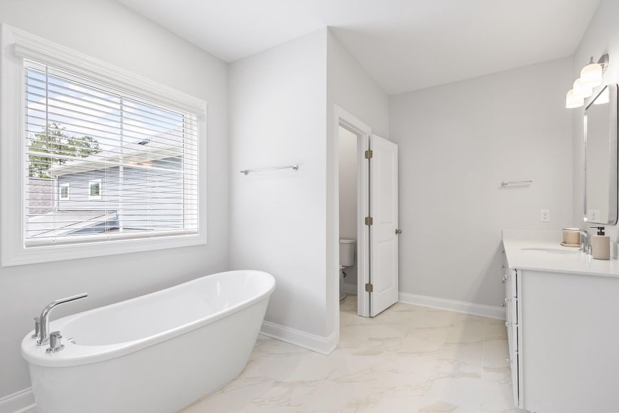 Furnished interior view inside a new home in Tidewater at Lakes of Cane Bay, Summerville (Image 37).