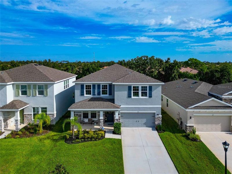 Front exterior of a new home in , Apollo Beach, FL, highlighting curb appeal (Image 30).