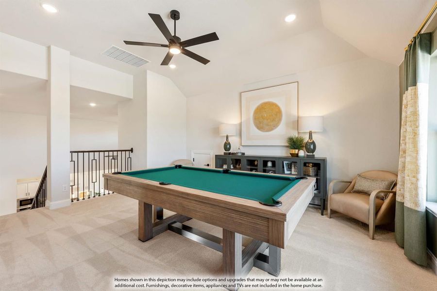 Game room with pool table, vaulted ceiling, ceiling fan, and carpet flooring near open staircase railing.