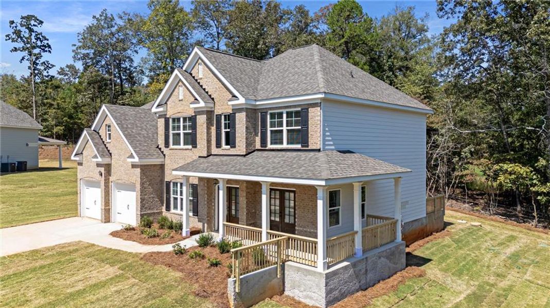 Front exterior of a new home in The Landing at Miller’s Ferry, Adairsville, GA, highlighting curb appeal (Image 20). Front exterior of a new home in The Landing at Miller’s Ferry, Adairsville, GA, highlighting curb appeal (Image 20).