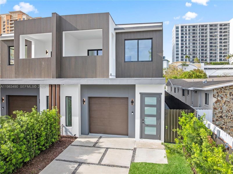 Front exterior of a new home in , Miami, FL, highlighting curb appeal (Image 25). Front exterior of a new home in , Miami, FL, highlighting curb appeal (Image 25).