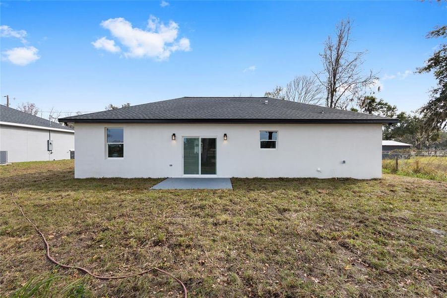 Exterior details and patio area of a home in , Summerfield (Image 15).