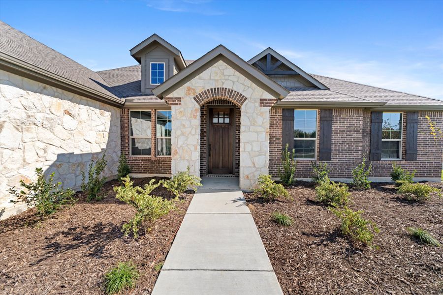 Front exterior of a new home in Parker Heights, Valley View, TX, highlighting curb appeal (Image 27). Front exterior of a new home in Parker Heights, Valley View, TX, highlighting curb appeal (Image 27).