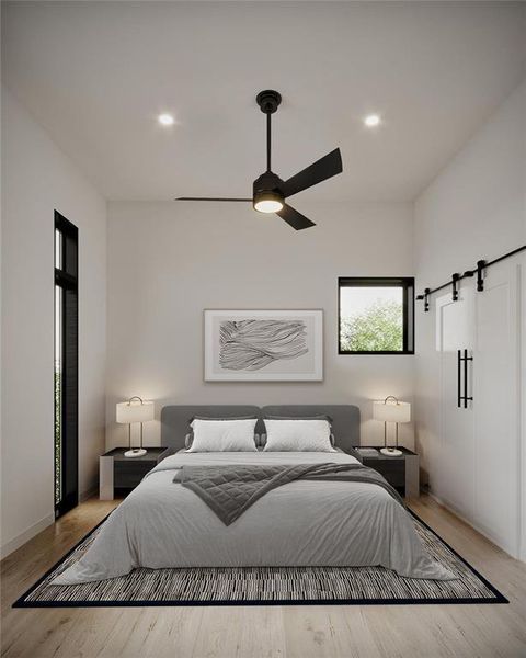 Bedroom featuring ceiling fan and light wood-type flooring