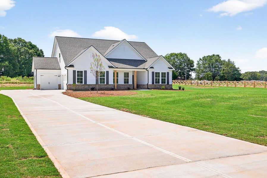 Front exterior of a new home in , Good Hope, GA, highlighting curb appeal (Image 23). Front exterior of a new home in , Good Hope, GA, highlighting curb appeal (Image 23).