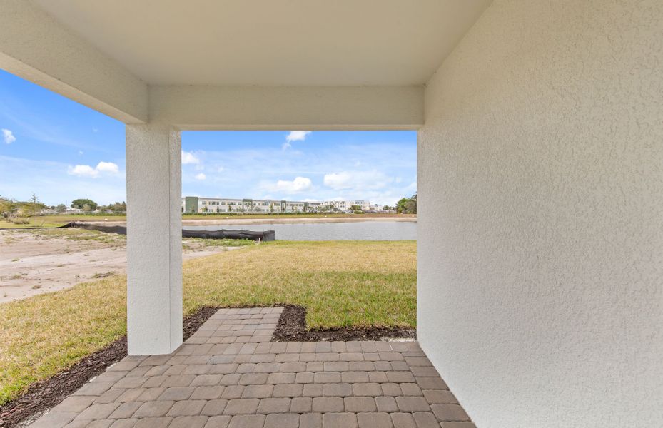Exterior details and patio area of a home in Whispering Lakes, Lehigh Acres (Image 3).