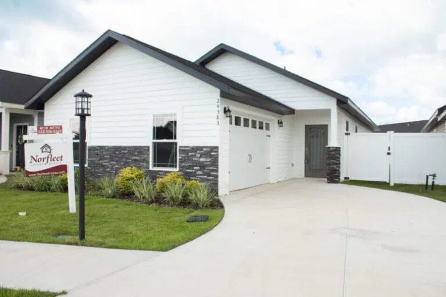 Representative exterior photo of a completed home built from the Dixie-Cottage by NORFLEET HOMES in Countryway Town Square, Newberry, FL (Image 1). Representative exterior photo of a completed home built from the Dixie-Cottage by NORFLEET HOMES in Countryway Town Square, Newberry, FL (Image 1).
