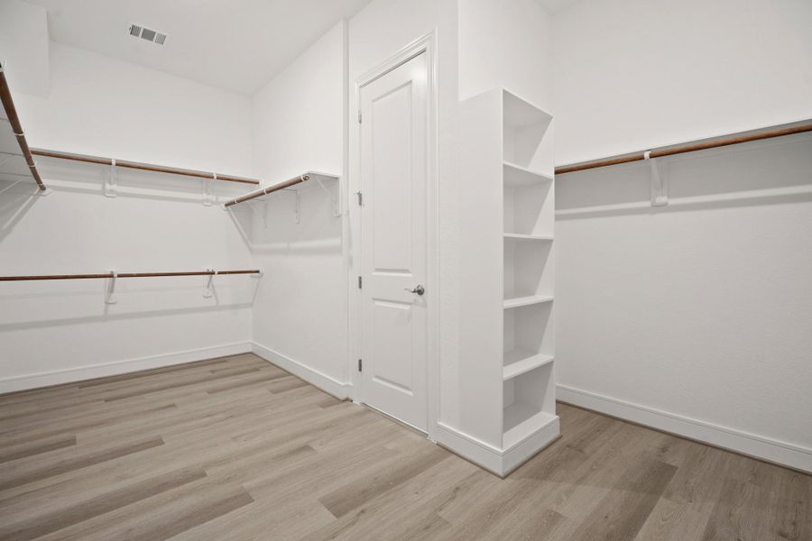 Primary walk-in closet (*Photo not of actual home and used for illustration purposes only.) Primary walk-in closet (*Photo not of actual home and used for illustration purposes only.)