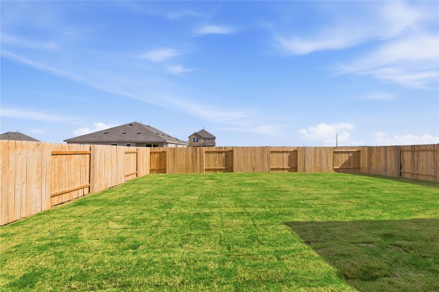Exterior details and patio area of a home in Infinity Square, Kyle (Image 3).