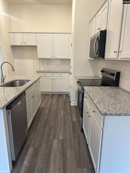 Furnished interior view inside a new home in Piney Woods Bluff, Columbia (Image 6). Furnished interior view inside a new home in Piney Woods Bluff, Columbia (Image 6).