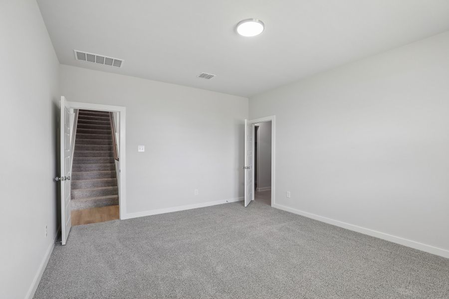 Primary in the Holden home plan by Trophy Signature Homes