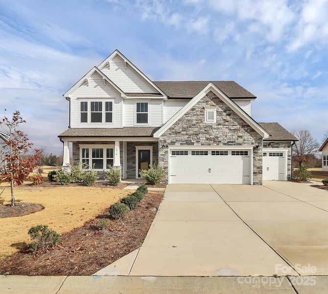 Front exterior of a new home in Stonebridge Fairways, Monroe, NC, highlighting curb appeal (Image 21).