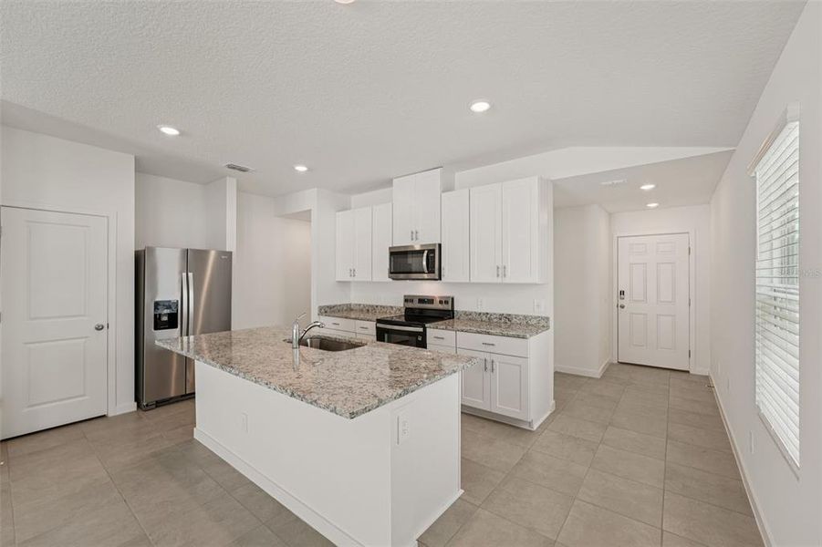 Furnished interior view inside a new home in Flagler Village - Classic Series, Palm Coast (Image 10).