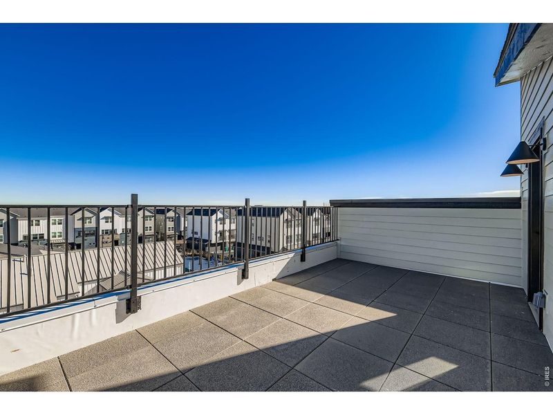 Exterior details and patio area of a home in Parkside West at Baseline, Broomfield (Image 25).