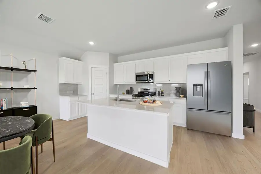 Kitchen in the Hadley home plan by Trophy Signature Homes – REPRESENTATIVE PHOTO Kitchen in the Hadley home plan by Trophy Signature Homes – REPRESENTATIVE PHOTO
