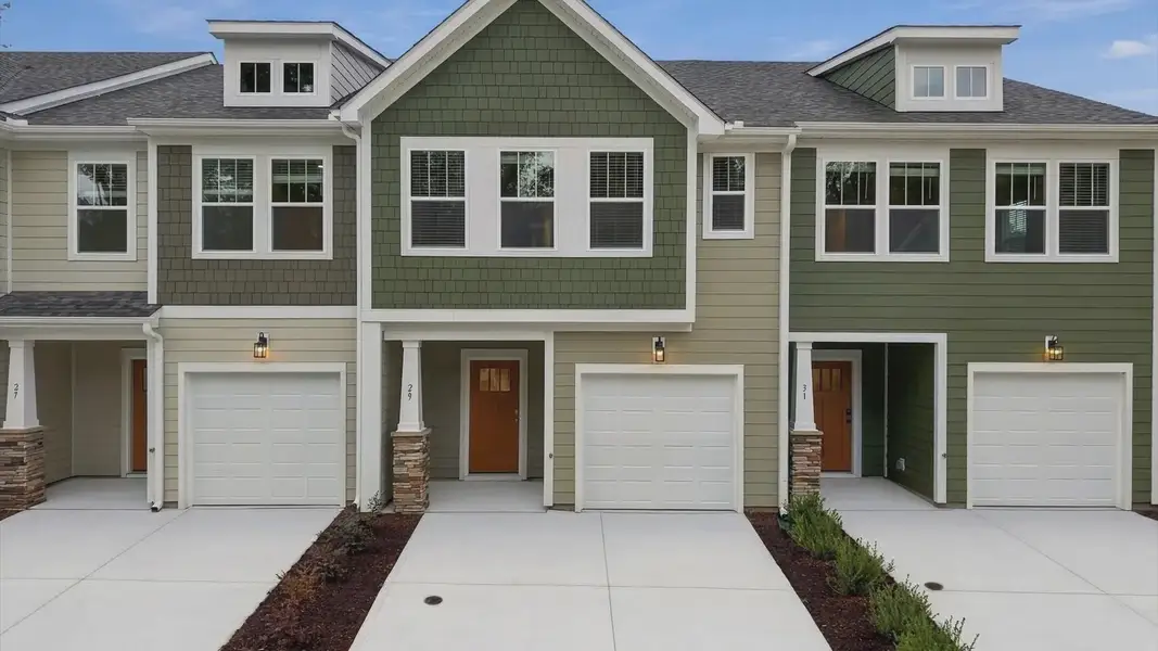 Front exterior of a new home in Brookland Place, Hendersonville, NC, highlighting curb appeal (Image 22). Front exterior of a new home in Brookland Place, Hendersonville, NC, highlighting curb appeal (Image 22).
