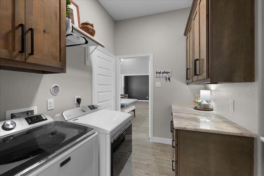Laundry room with garage door entry and view to dining room.