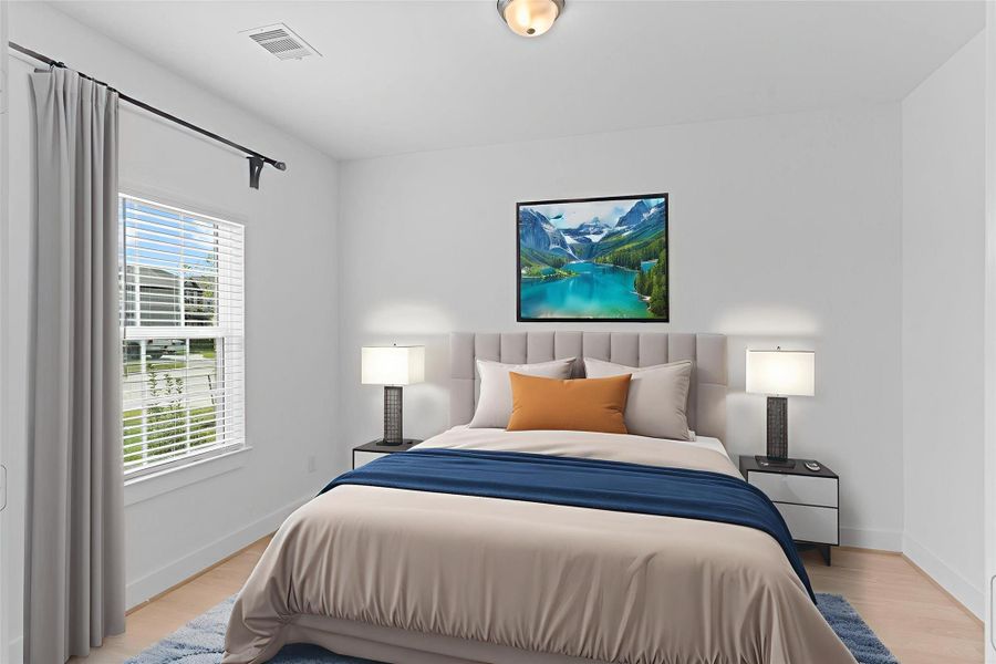 Bright and inviting guest bedroom complete with high ceilings and a roomy walk-in closet. *Photo is Virtually Staged*