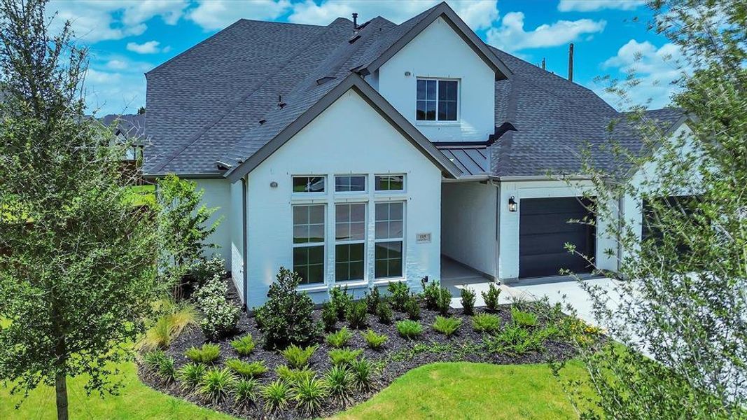 Contemporary exterior featuring white brick siding and dark-gray trim Contemporary exterior featuring white brick siding and dark-gray trim