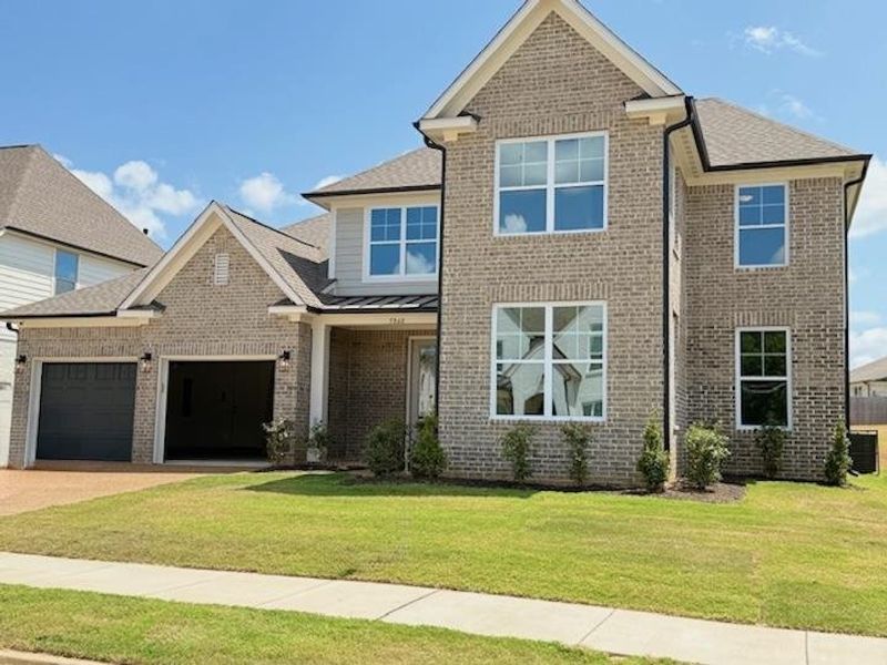 Front exterior of a new home in White Oak, Arlington, TN, highlighting curb appeal (Image 1). Front exterior of a new home in White Oak, Arlington, TN, highlighting curb appeal (Image 1).