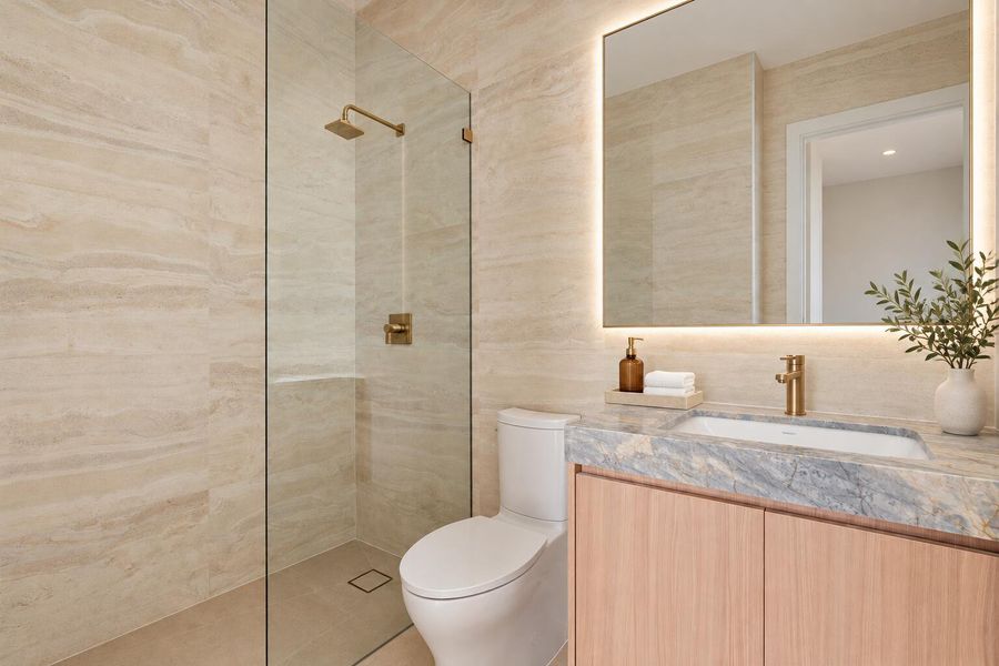 Polished Luxury Bathroom With Brass Fixt