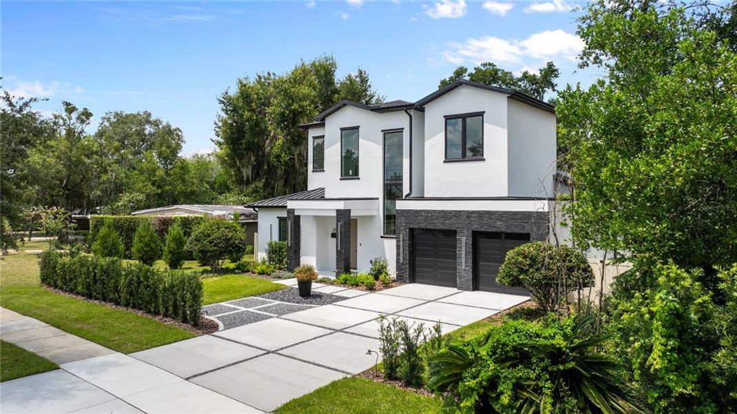 Front exterior of a new home in , Winter Park, FL, highlighting curb appeal (Image 2). Front exterior of a new home in , Winter Park, FL, highlighting curb appeal (Image 2).